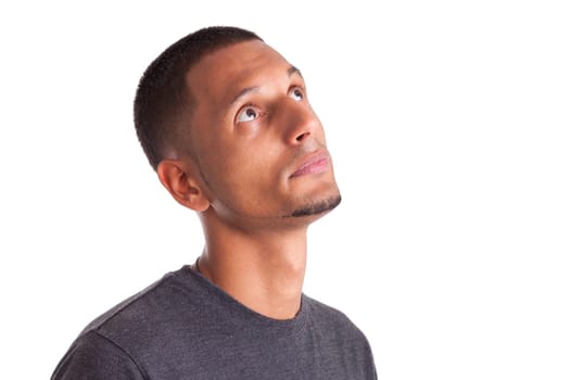 Close up portrait of a young african american man looking up, isolated on white background