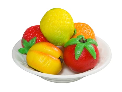 Marzipan Fruit on a white plate isolated on a white background