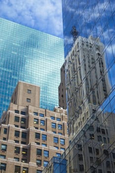 Skyscrapers with clouds reflection (New York City). Vertically.