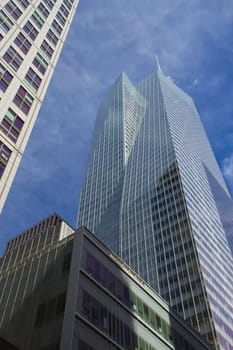 Skyscrapers with clouds reflection (New York City). Vertically.