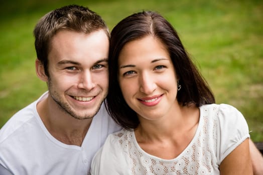 Outdoor portrait of young beautiful happy smiling couple