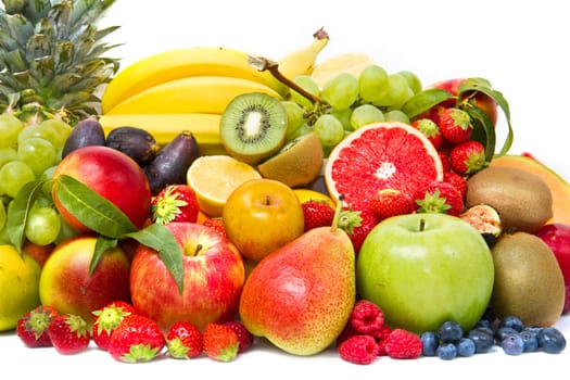 Fruits and vegetables like tomatoes, zucchini, melons, bananas and grapes arranged in a group, natural still life for healthy food