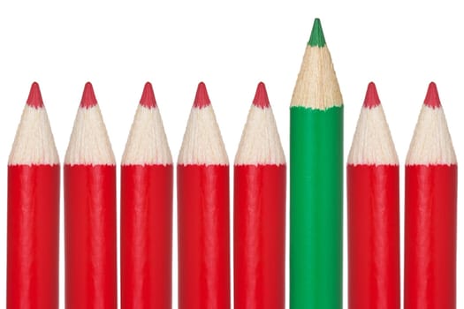 Many red pencils and one green. Isolated on white background