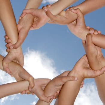 Hands together against the sky