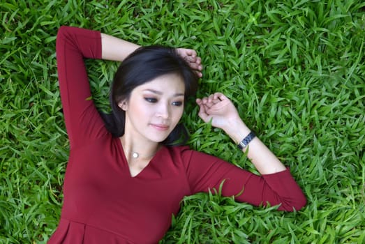 pretty woman in red dress at the garden
