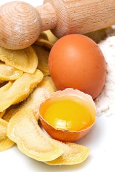 isolated ravioli with ingredients on white background
