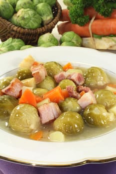 a plate of Brussels sprout stew with colorful vegetables and bacon