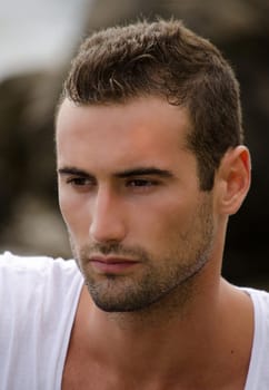 Headshot of good looking male model, brown eyes and hair
