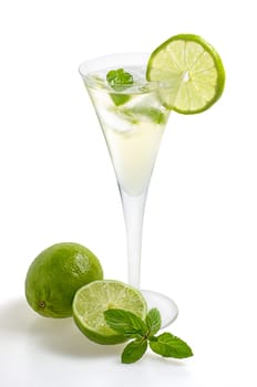 Aperitif with limes and mint in a champagne flute