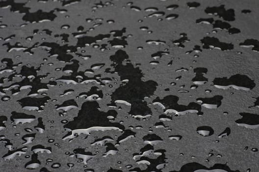 Macro shot of a slate slab with water droplets