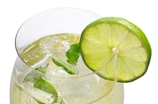Aperitif with limes and mint in a wine glass