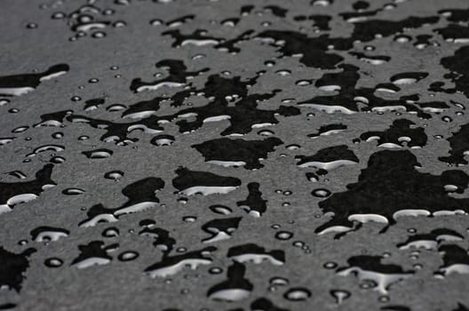 Macro shot of a slate slab with water droplets