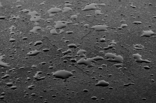 Macro shot of a slate slab with water droplets
