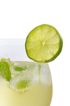 Aperitif with limes and mint in a wine glass