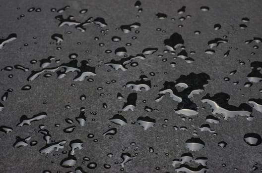 Macro shot of a slate slab with water droplets