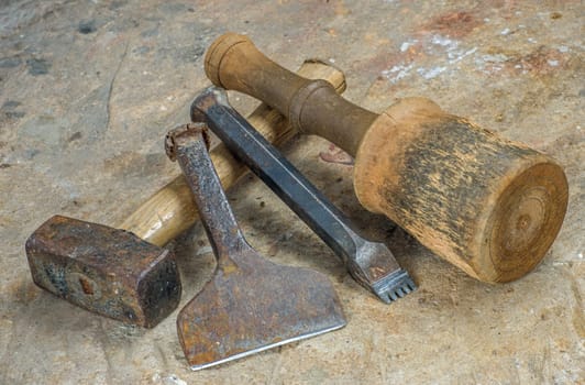 Stonemason's tool on a sandstone slab