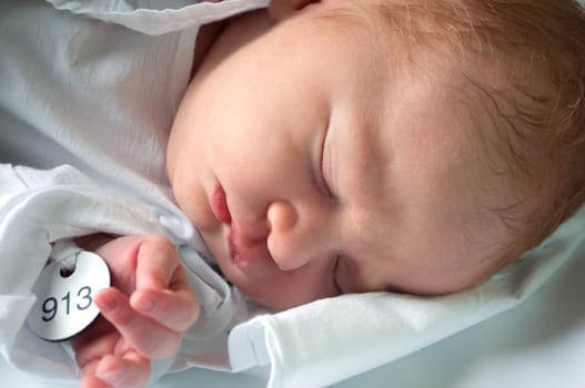 Closeup of Sleeping Newborn Baby in Maternity Hospital