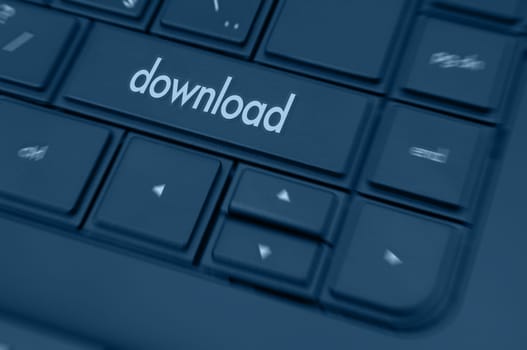 Closeup of Notebook Keyboard in Shades of Blue With Download Key.