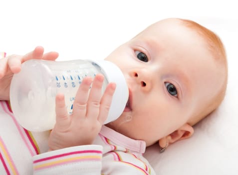 Closeup of Baby Girl Drinking Milk from Bottle