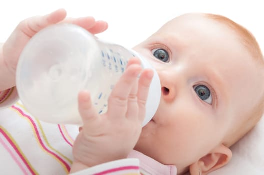 Closeup of Baby Girl Drinking Milk from Bottle