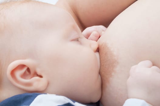 Closeup of Mother Breast Feeding Her Baby