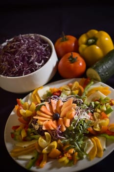 Mixed green salad with raw fruits and vegetables