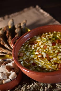 Real food photographed on location in traditional portuguese restaurants, cold soup gaspacho with fried horse mackerel - gaspacho com carapaus fritos - Alentejo, Portugal