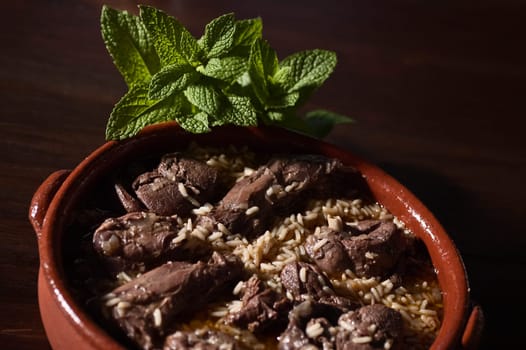 Real food photographed on location in traditional portuguese restaurants, hare cooked on red wine with rice - arroz de lebre - Alentejo, Portugal