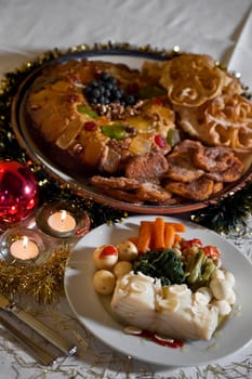 Real food photographed on location in traditional portuguese restaurants, Christmas supper with boiled codfish and various pastry, Alentejo, Portugal