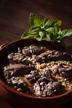 Real food photographed on location in traditional portuguese restaurants, hare cooked on red wine with rice - arroz de lebre - Alentejo, Portugal