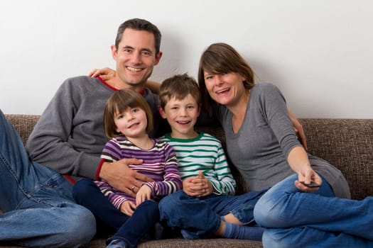 Family sitting on the sofa