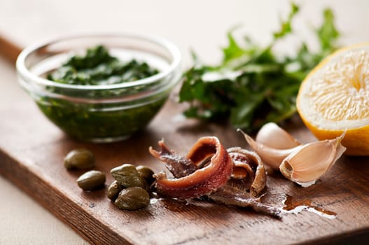 Anchovies with capers, garlic and lemon close up