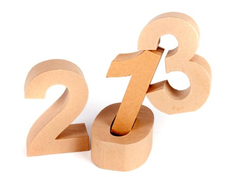Paper numbers an a christmas ball forming 2013 as for the new year