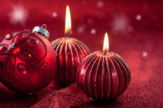Christmas ornament with candles in red tone with glittering background