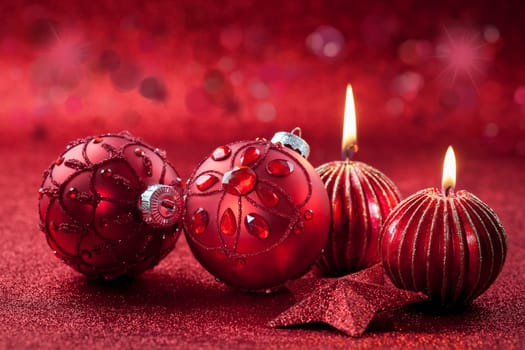 Christmas ornament with candles in red tone with glittering background
