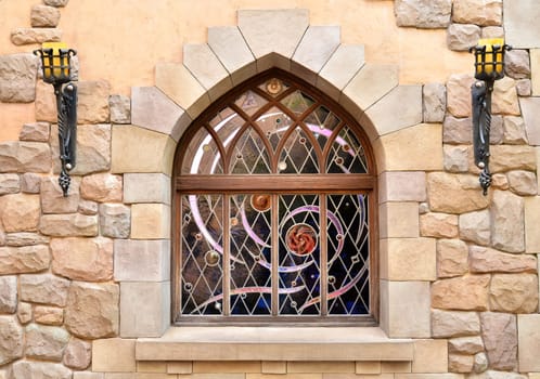 Arched window in a stone wall
