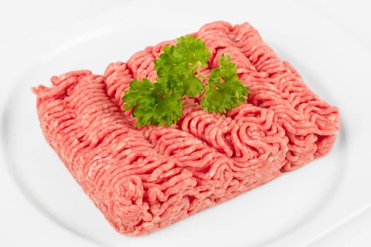 fresh minced meat on a white plate