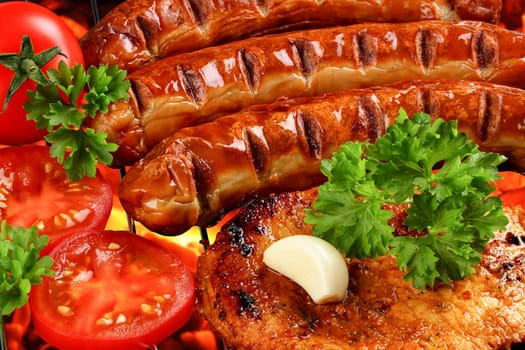 Grilled meat and vegetables on charcoal grill.