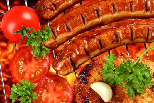 Grilled meat and vegetables on charcoal grill.