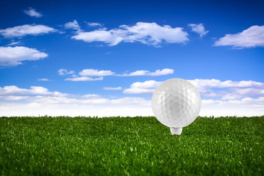 Golf ball on tee on the green