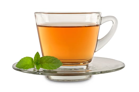 A glass cup with tea and peppermint leaf