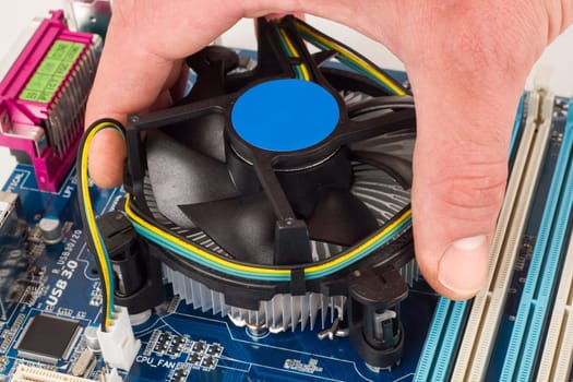 Installation of a CPU with cooler on a motherboard