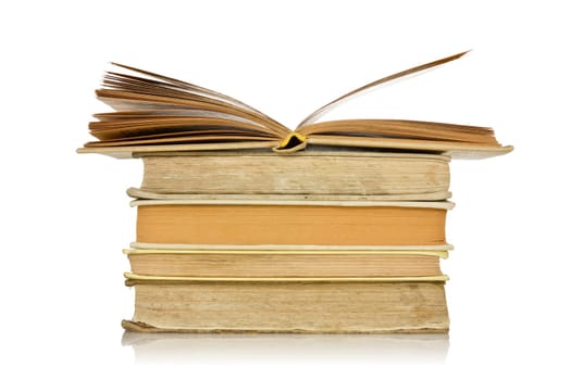 stack of old books with reflection on  white background