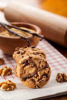 Christmas chocolate cookies with baking ingredients and rolling pin