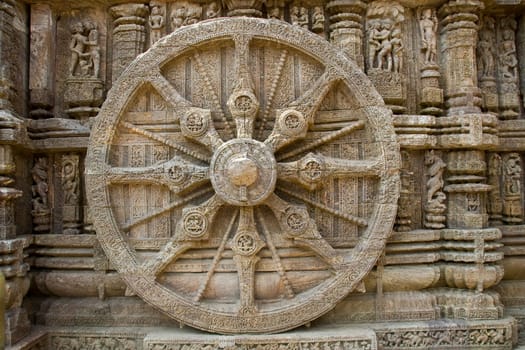 Detail s of rim, spokes and axle on chariot stone wheel at Sun Temple, Konark, Orissa, India, Asia