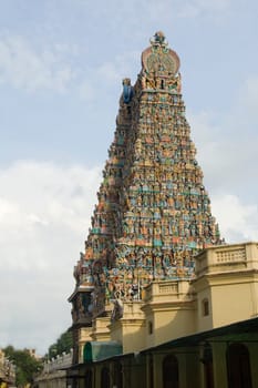 Temple tower, extensively sculpted with religious figures, at Meenakshi Temple, Madurai, Tamil Nadu, India, Asia
