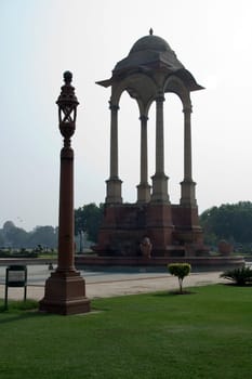 Stone pillars supporting canopy and lamp post near India Gate in New Delhi, India, Asia