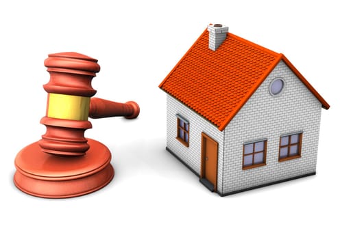 A house with hammer on the white background.