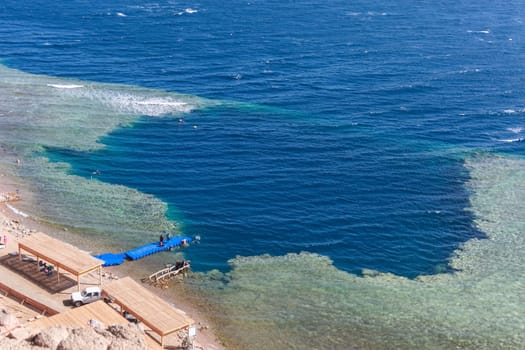Blue Hole is a popular diving location on east Sinai, a few kilometres north of Dahab, Egypt on the coast of the Red Sea.