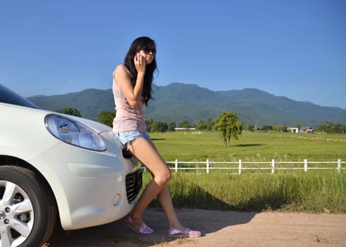 pretty women use her phone in the country